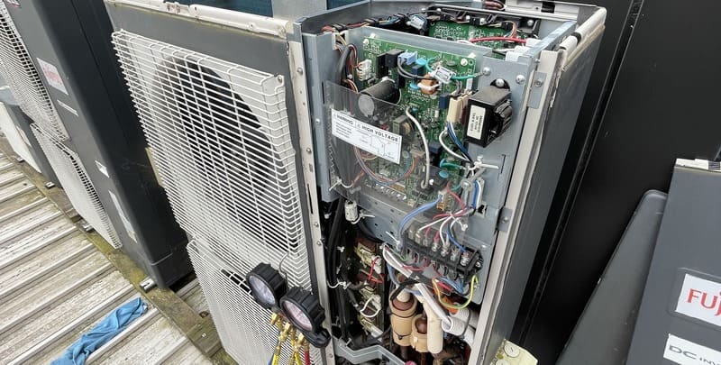An air conditioner being serviced by Air Con Service Near Me